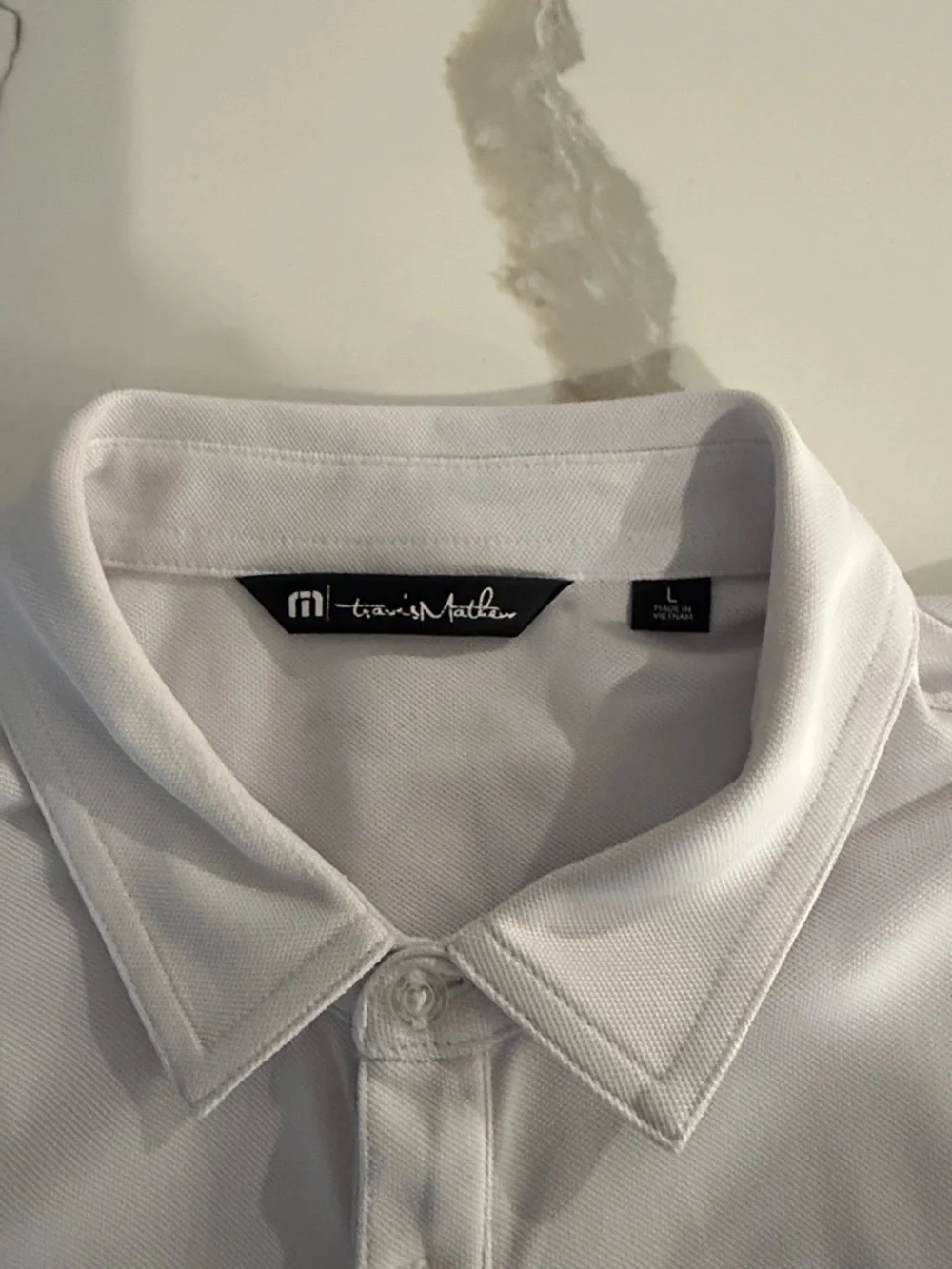 Travis Mathew White Polo with Navy and Yellow Stripes - Picture 2 of 5